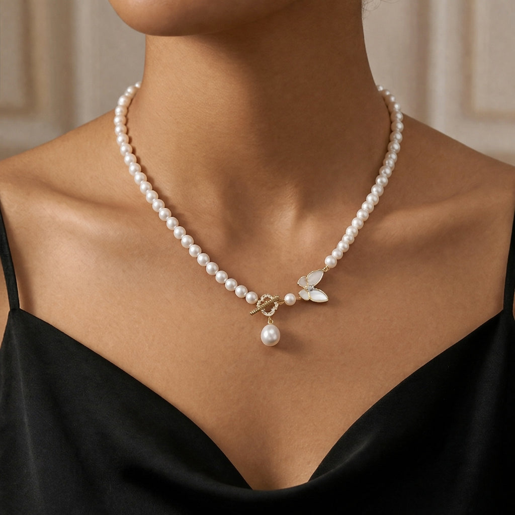 Elegant Pearl Necklace with Butterfly and Pearl Pendant