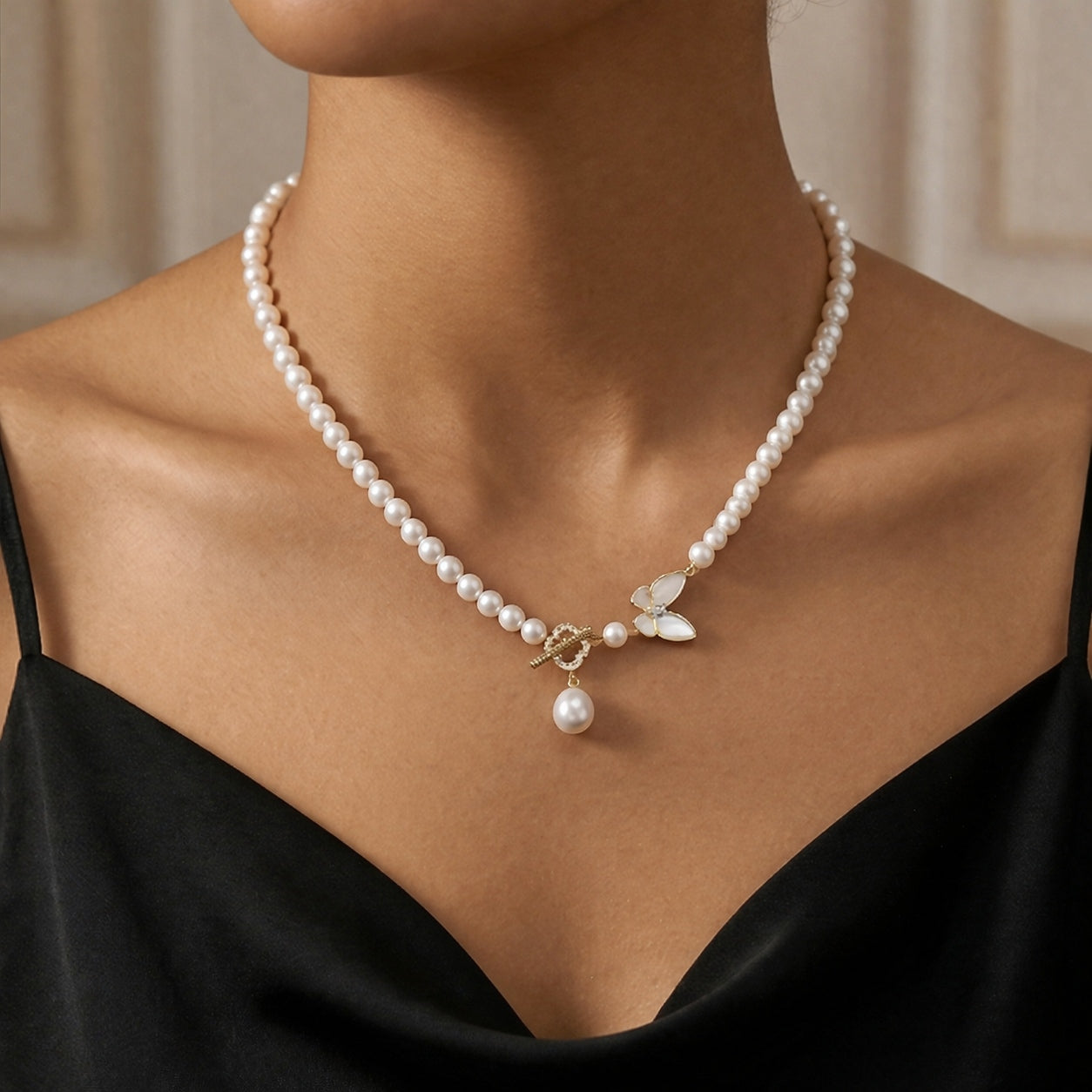 Elegant Pearl Necklace with Butterfly and Pearl Pendant