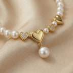 Pearl Necklace with Heart-Shaped Gold Pendants and Droplet Pearl